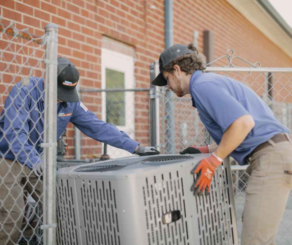 Ted's technicians installing a new AC